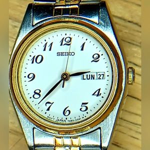 X Seiko White dial, 3 hand movement Day & Date. Two tone Silver and gold br